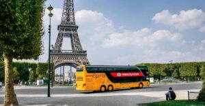 Paris: Audio-Guided Bus Tour & Seine River Cruise - Inside the luxury coach: host narration plus tablet-style visuals